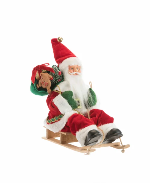 Père Noël traditionnel en tissu rouge et vert sur luge avec hotte - 30 cm